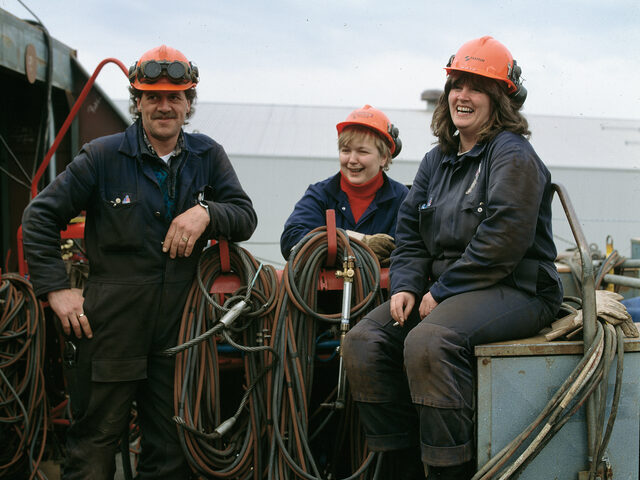 Three welders in the production